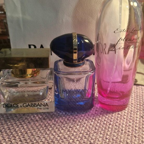 Pack of three used empty perfume bottles
