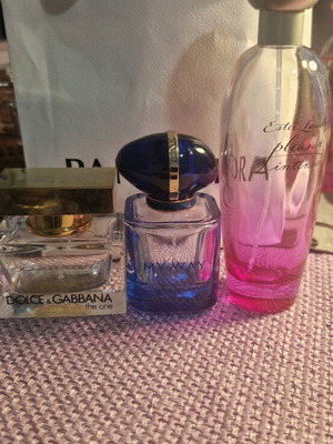 Pack of three used empty perfume bottles