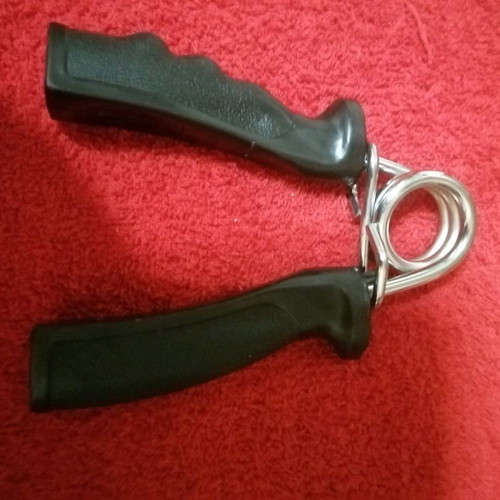 Spring fitness hand gripper new, intact