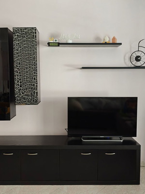 Living room TV unit with glass storage boxes, black