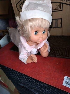 Baby doll with battery like new, crawls and moves head and hands