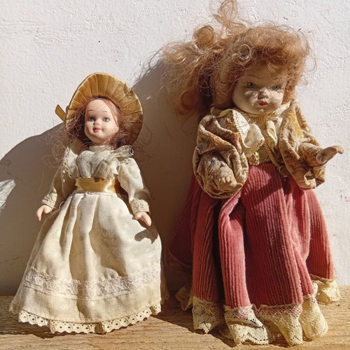 Porcelain dolls used, set of two 21 and 18 cm