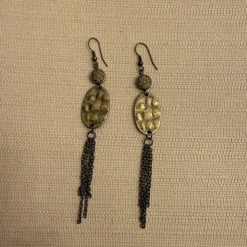 Dangling earrings lightly worn