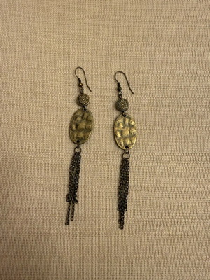 Dangling earrings lightly worn