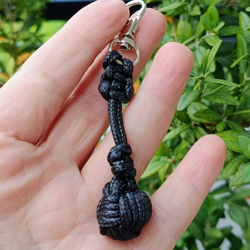 Handmade men's keychain with black leather cord and football ball