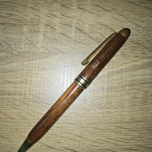 Wooden pen used with blue ink