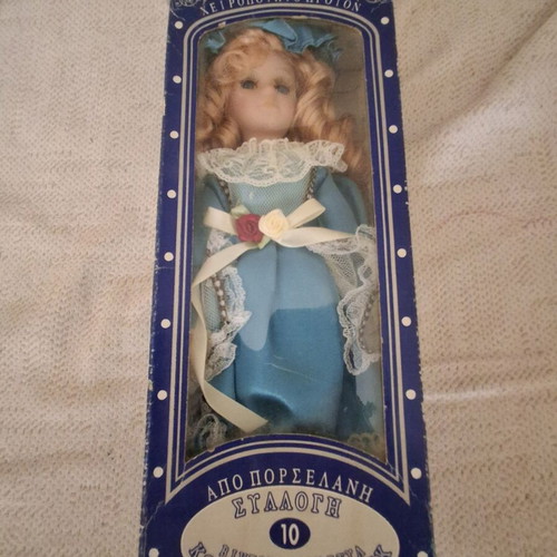Porcelain doll new, unused