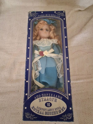 Porcelain doll new, unused