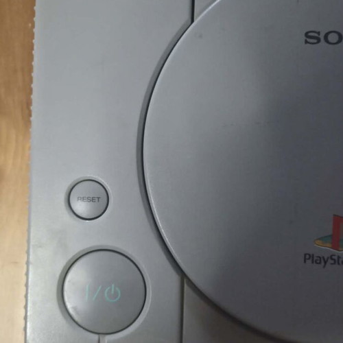 Sony PlayStation 1 console used with memory card, controller, and game