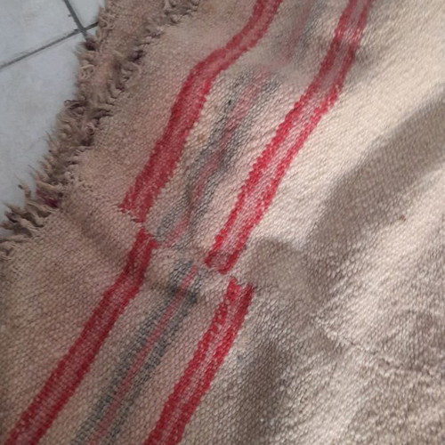 Kilim used light with fringes brown with red stripes
