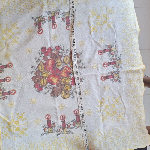 Small tablecloth with candles and fruit used
