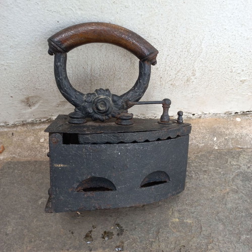 Karavaki Charcoal Iron used with ornate handle design