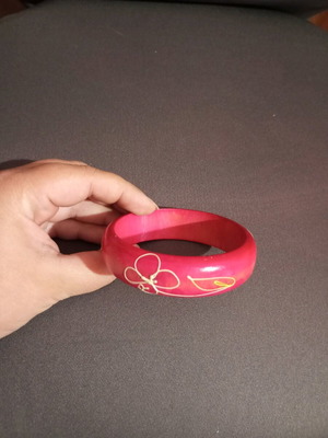 Wooden pink bracelet with flower design like new