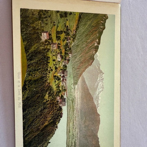Leather-bound book with used Swiss Geneva postcard images
