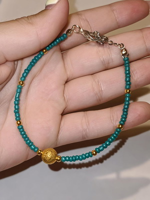 Handmade bracelet with gold, green and blue beads, silver clasp, new