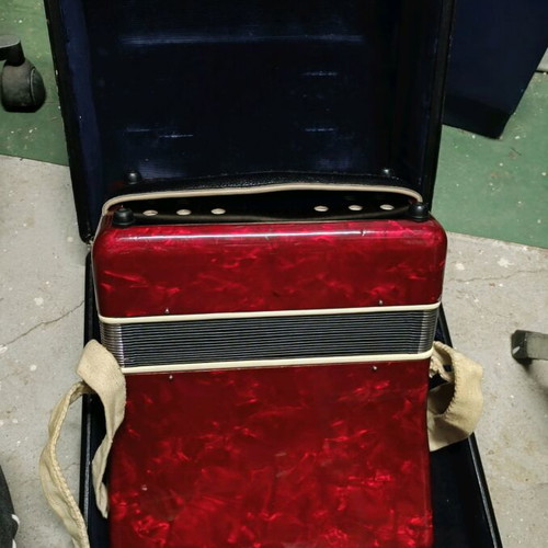 Accordion piano type with red pearlescent lid in case