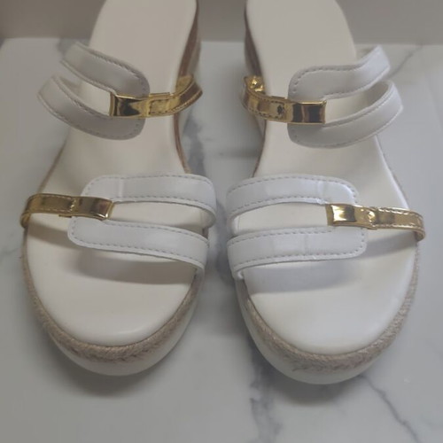 Women's sandals new with white straps and gold platform details