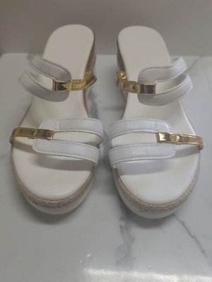 Women's sandals new with white straps and gold platform details