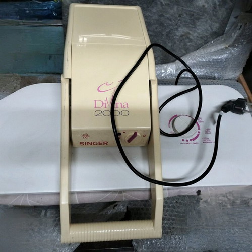 Singer press used