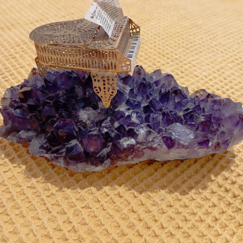 Vintage decorative piano on natural amethyst rock, gold-plated