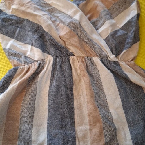 Linen sleeveless top used with earth-tone stripes, size M