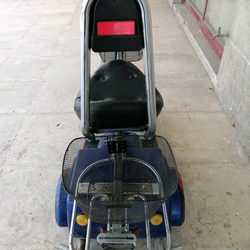 Electric three-wheeler used with two baskets and hill assist