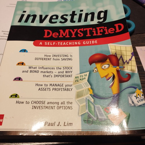 Investing Demystified book by Paul Lim like new, beginner investing guide