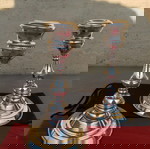 Ασημένια 925 κηροπήγια (2 ΤΕΜ.), ύψους   15 εκατοστών και διαμέτρου βάσης 8,5 εκατοστών. Με σφραγίδες. Βάρος συνολικό 324 γραμμάρια. Σε άριστη κατάσταση