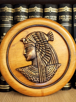 Old wall plaque with Cleopatra relief used, wooden