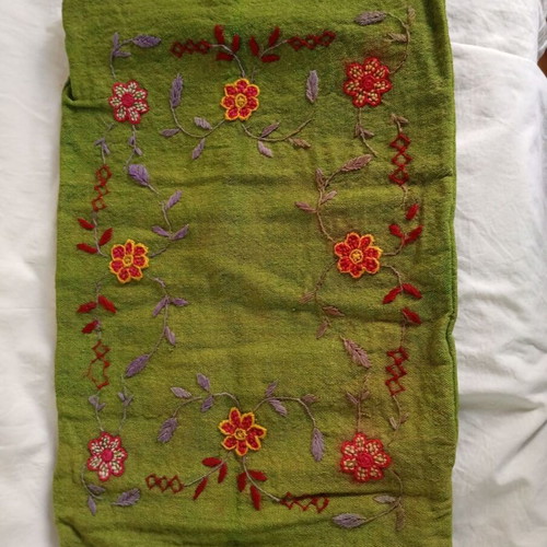 Embroidered green pillowcase used with details