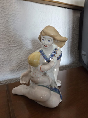 Decorative porcelain sculpture "Motherhood" like new