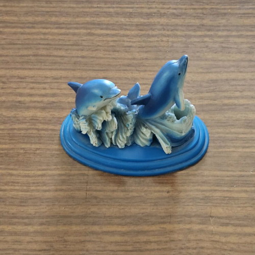 Decorative dolphin pencil holder used