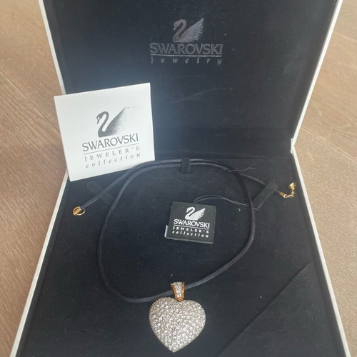 Swarovski necklace with heart pendant like new, white stones