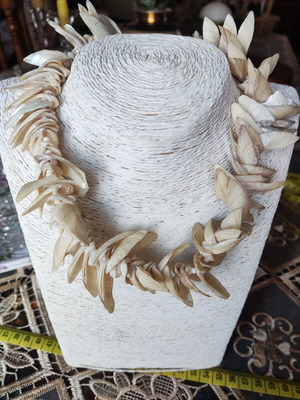 Vintage necklace made of natural shells in boho brutalist style, used