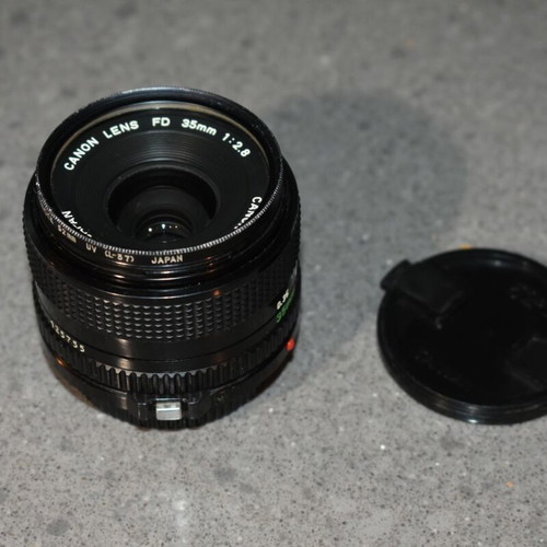 Canon A-1 collectible pack like new with Motor Drive, strap and 35mm f/2.8, 135mm lenses