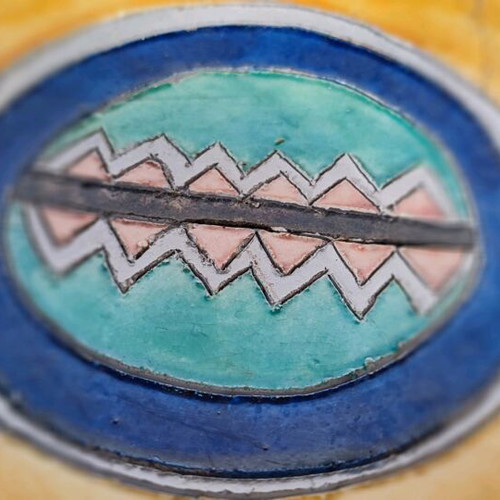 Mexican style ceramic plate and vase with plant composition used