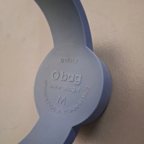 O clock watch used with blue silicone strap and Harlequin dial