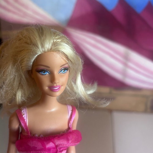 Mattel Barbie Beach doll with pink swimsuit and fuchsia dress