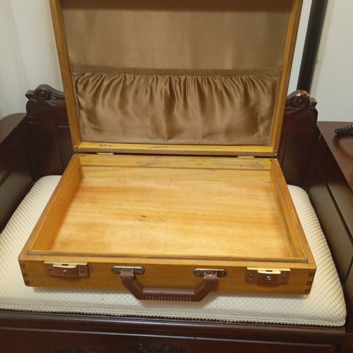 Vintage wooden suitcase made of genuine teak wood, used