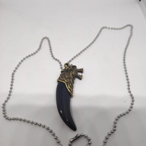 Necklace with wolf tooth pendant like new, gold and black