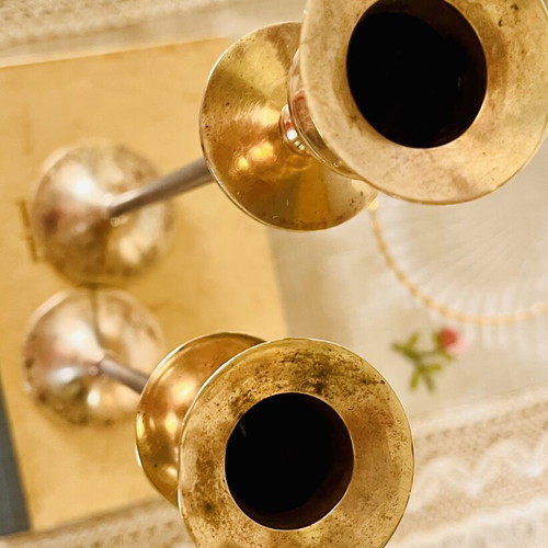 Vintage brass candlesticks with thin iron stems used