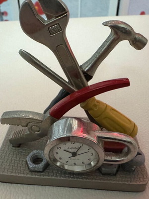 Decorative tabletop clock like new with tools theme
