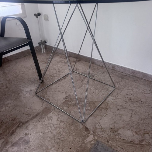 Round glass dining table used with silver detailing 100x76