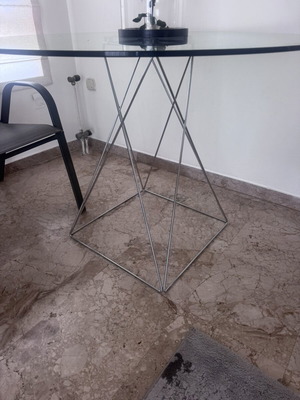 Round glass dining table used with silver detailing 100x76