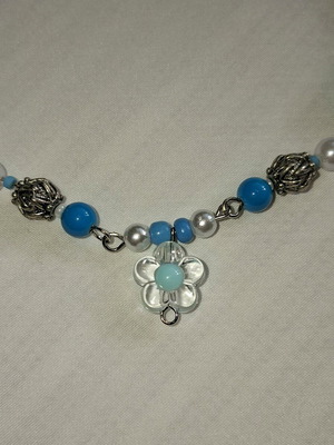 Handmade blue necklace with metal frame and beads
