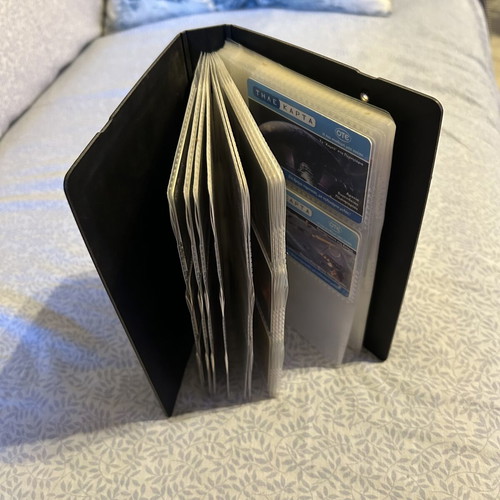 Phone card album with 32 universe-themed cards and 50 extra sleeves like new