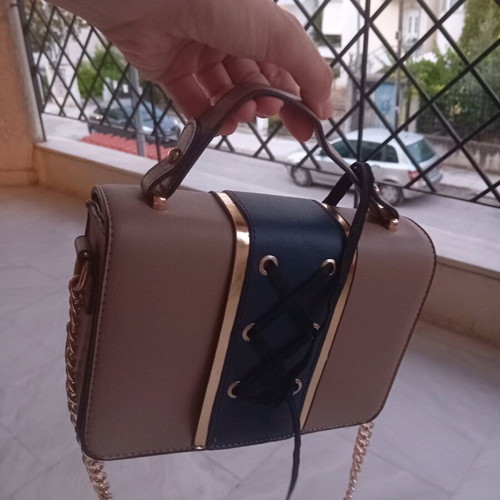 Nude shoulder and hand bag with blue and gold chain like new