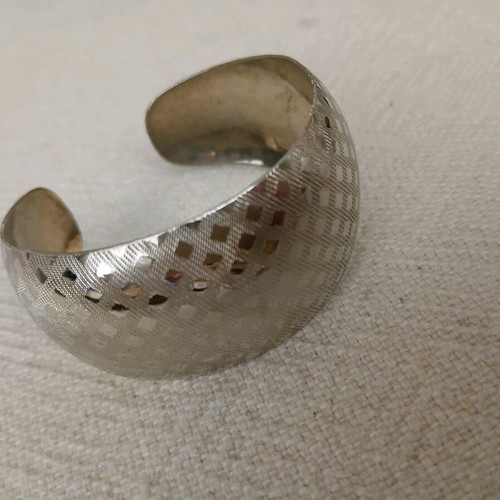 Vintage cuff bracelets like new, embossed geometric and floral design, set of 2