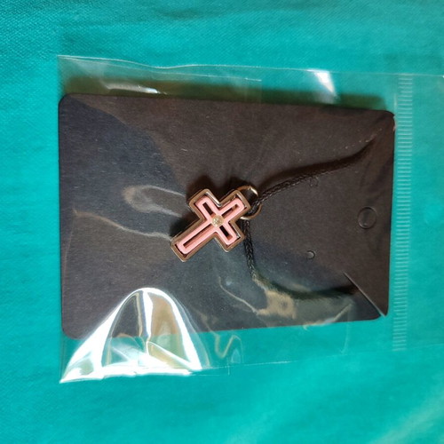 Cross made of silver and pink stainless steel new with adjustable cord
