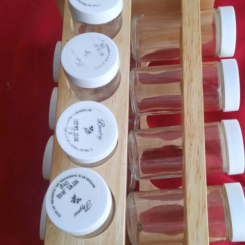 Spice jars used in wooden rotating rack with 16 glass containers